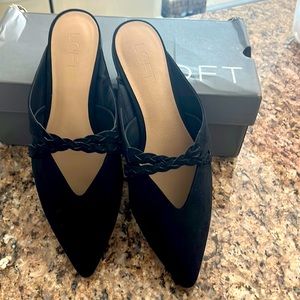 Pointed toe mules.